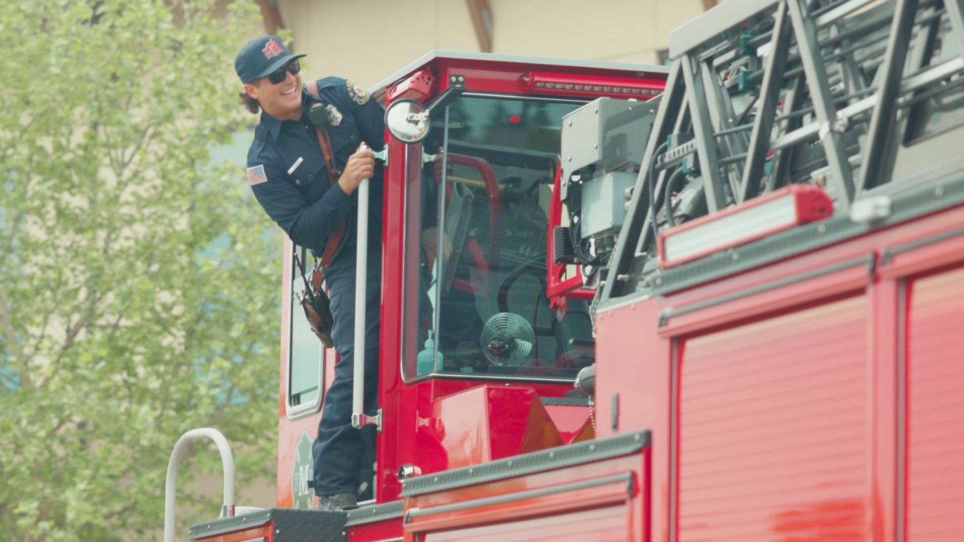 Smiling firefighter in his vehicle